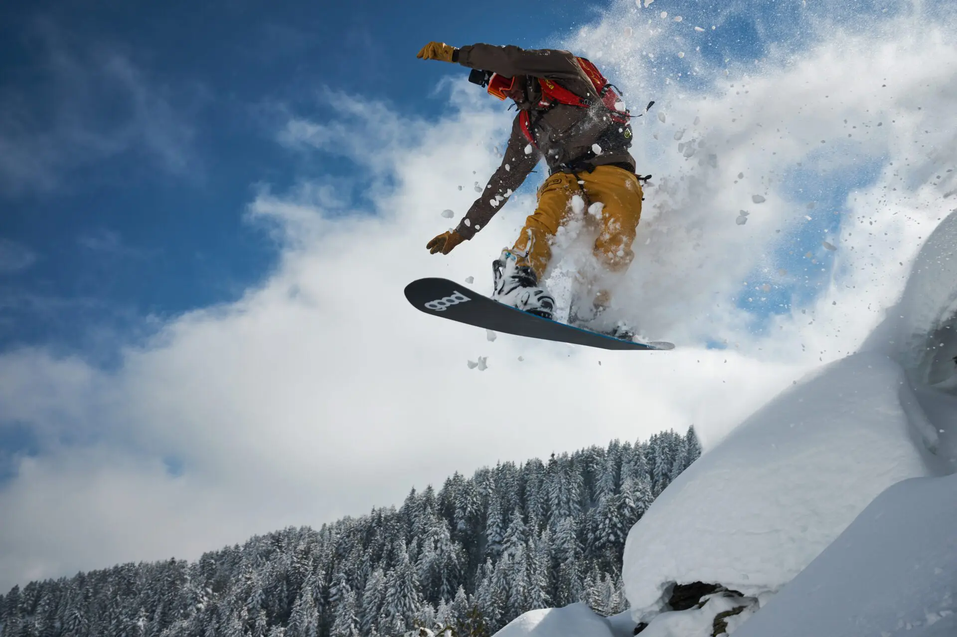 Snowboarder riding down the slopes of Gjeravica mountain in Kosovo.